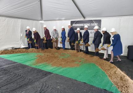 Leaders with shovels breaking ground