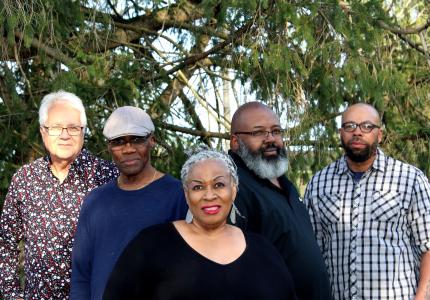 photo of the 5 members of the mission band with lady d
