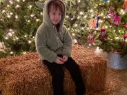 A child poses on the stage