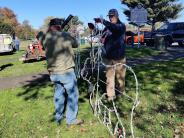 Volunteers set up light displays