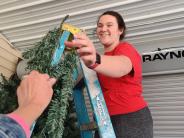 Volunteer assembling tree