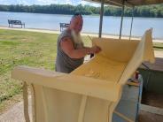 Volunteer painting a glider