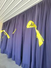 Wires hanging from ceiling with yellow tape
