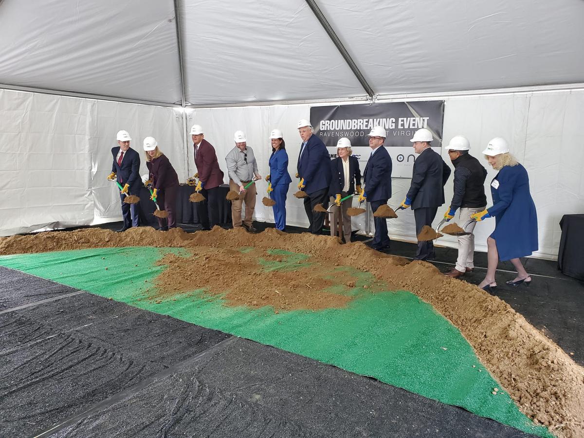 Leaders with shovels breaking ground