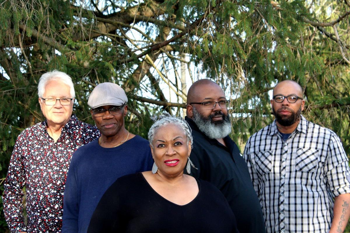 photo of the 5 members of the mission band with lady d